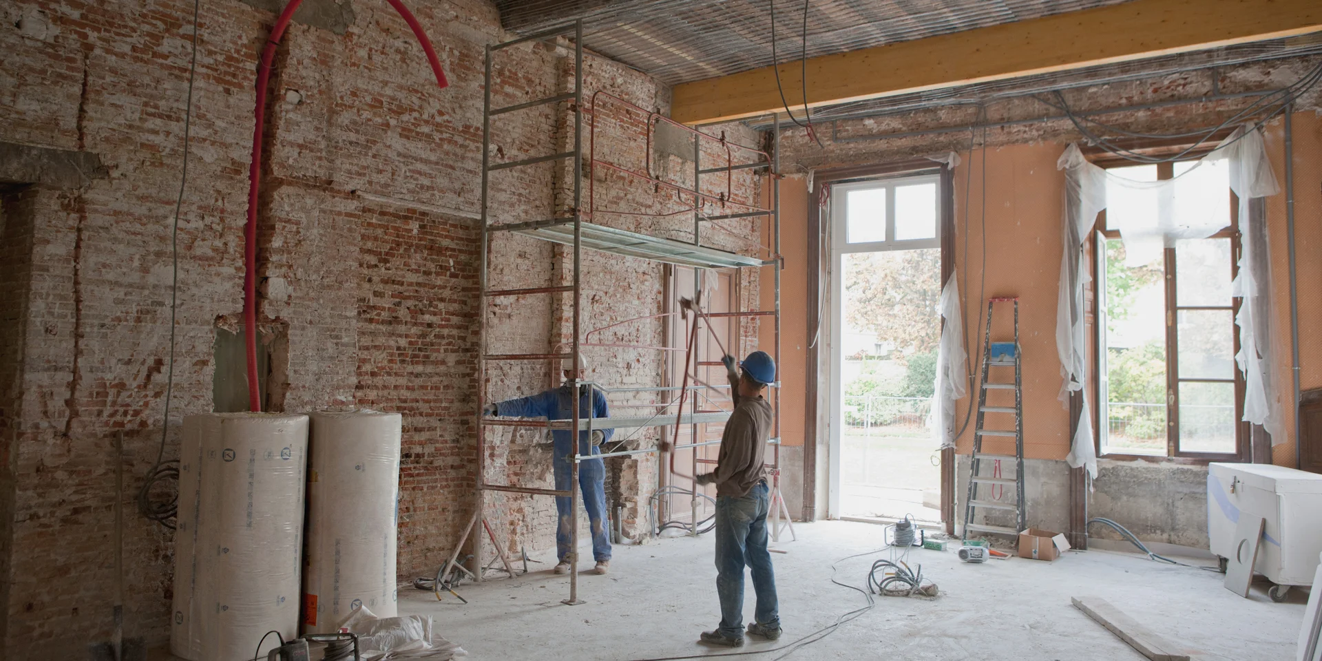 Two builders working on an interior renovation