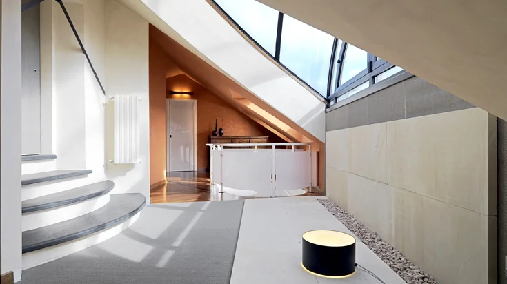 Contemporary interior with curved staircase and natural light