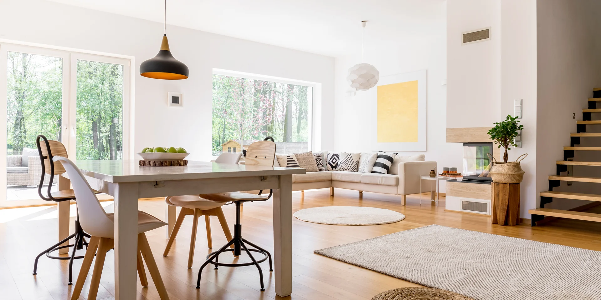Bright living and dining area with hardwood floors