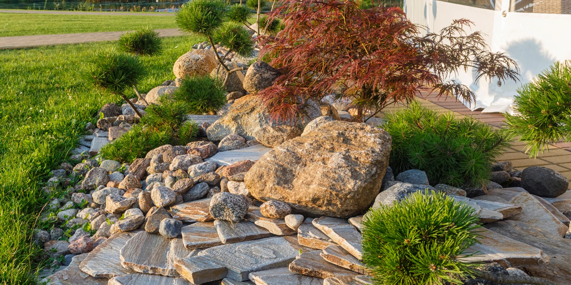 Rock garden with low-maintenance plants and stone path